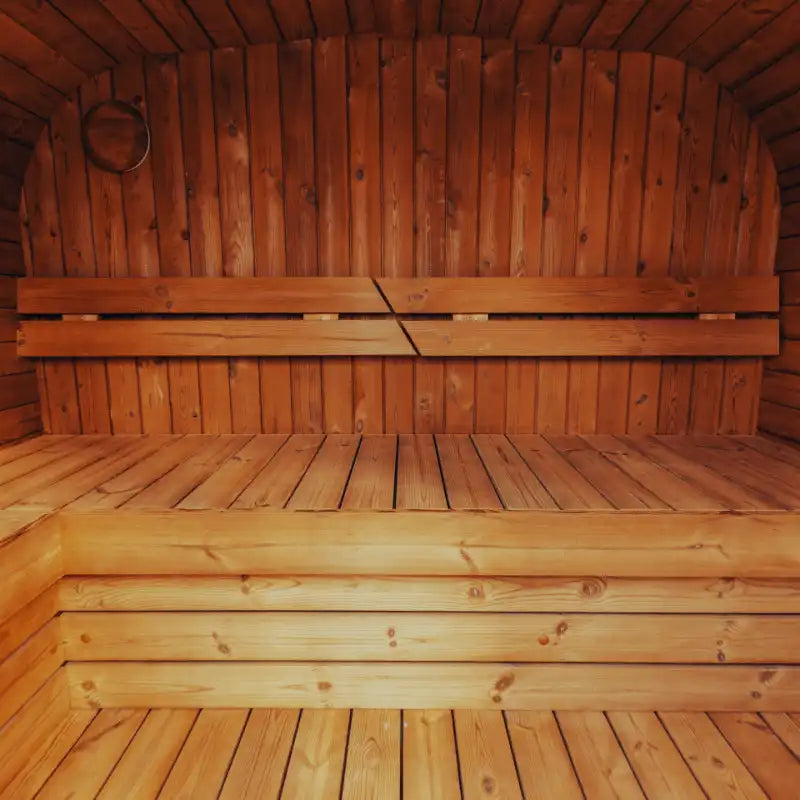 Wooden interior of a sauna with benches.